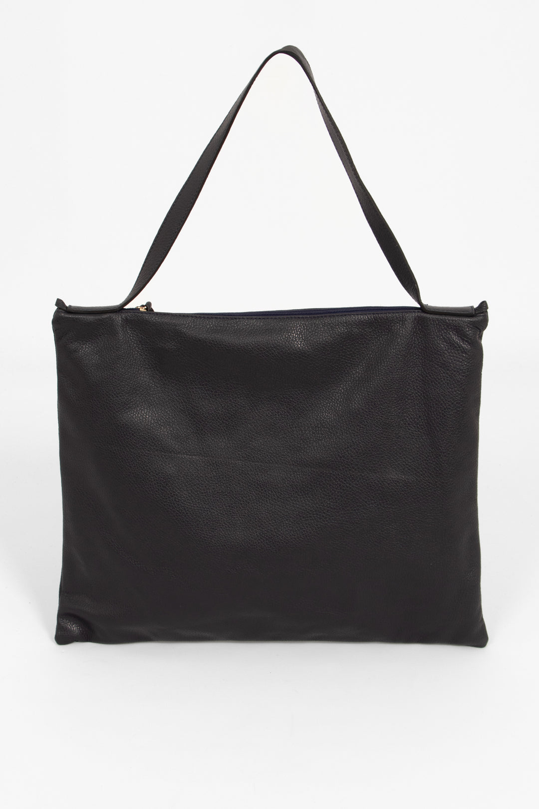 showing the back of the tote bag, the bag is made from pebbled navy blue leather