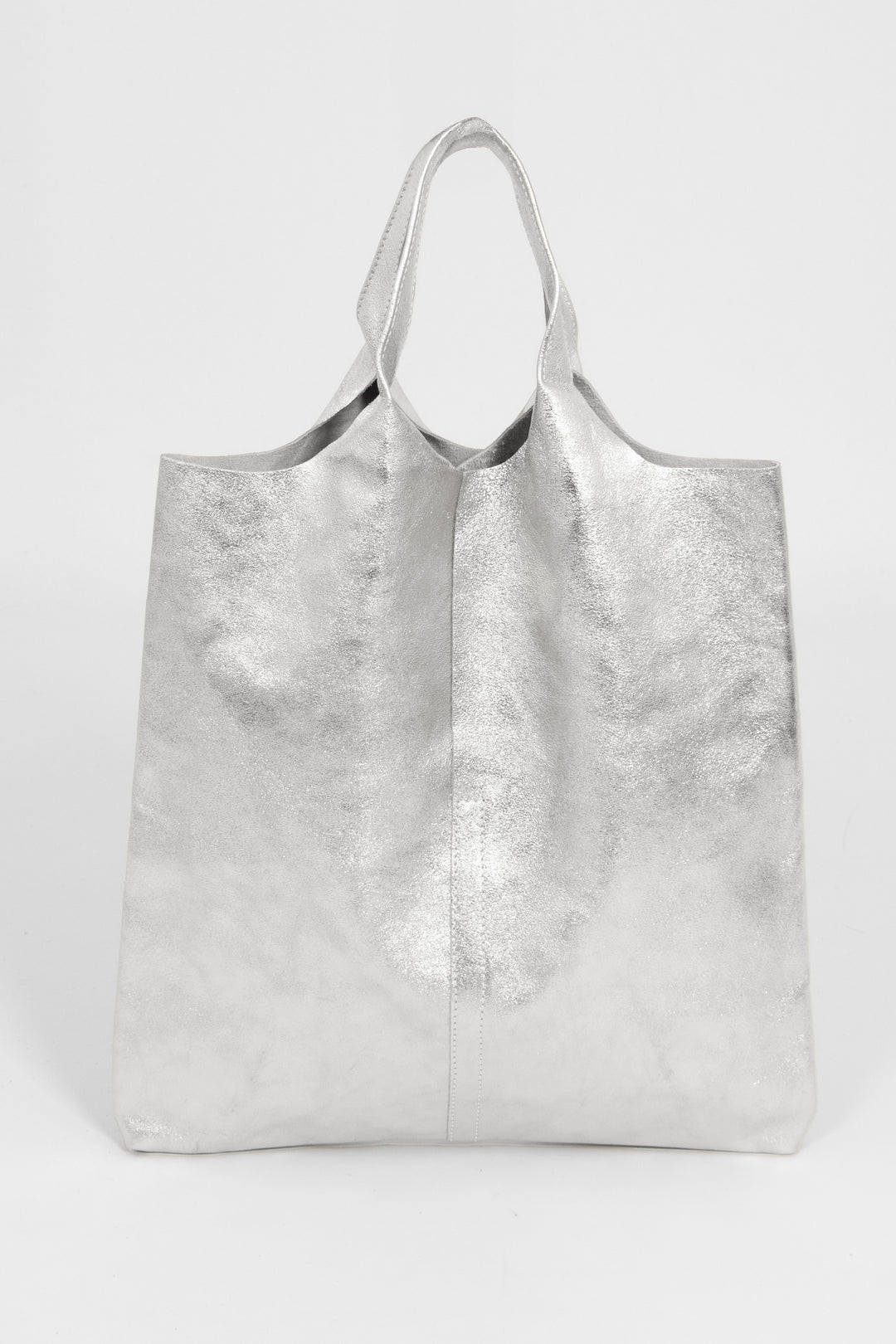 silver metallic leather tote bag with top carry handles. this bag is designed to be worn over the shoulder