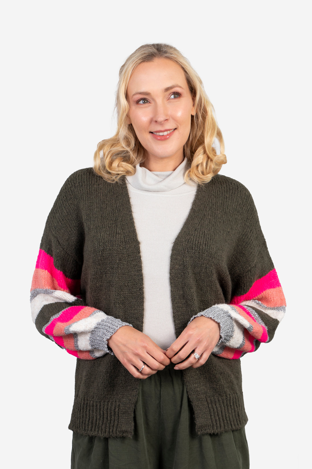 model wearing a khaki green open front cardigan with a pink and silver contrast stripe sleeves