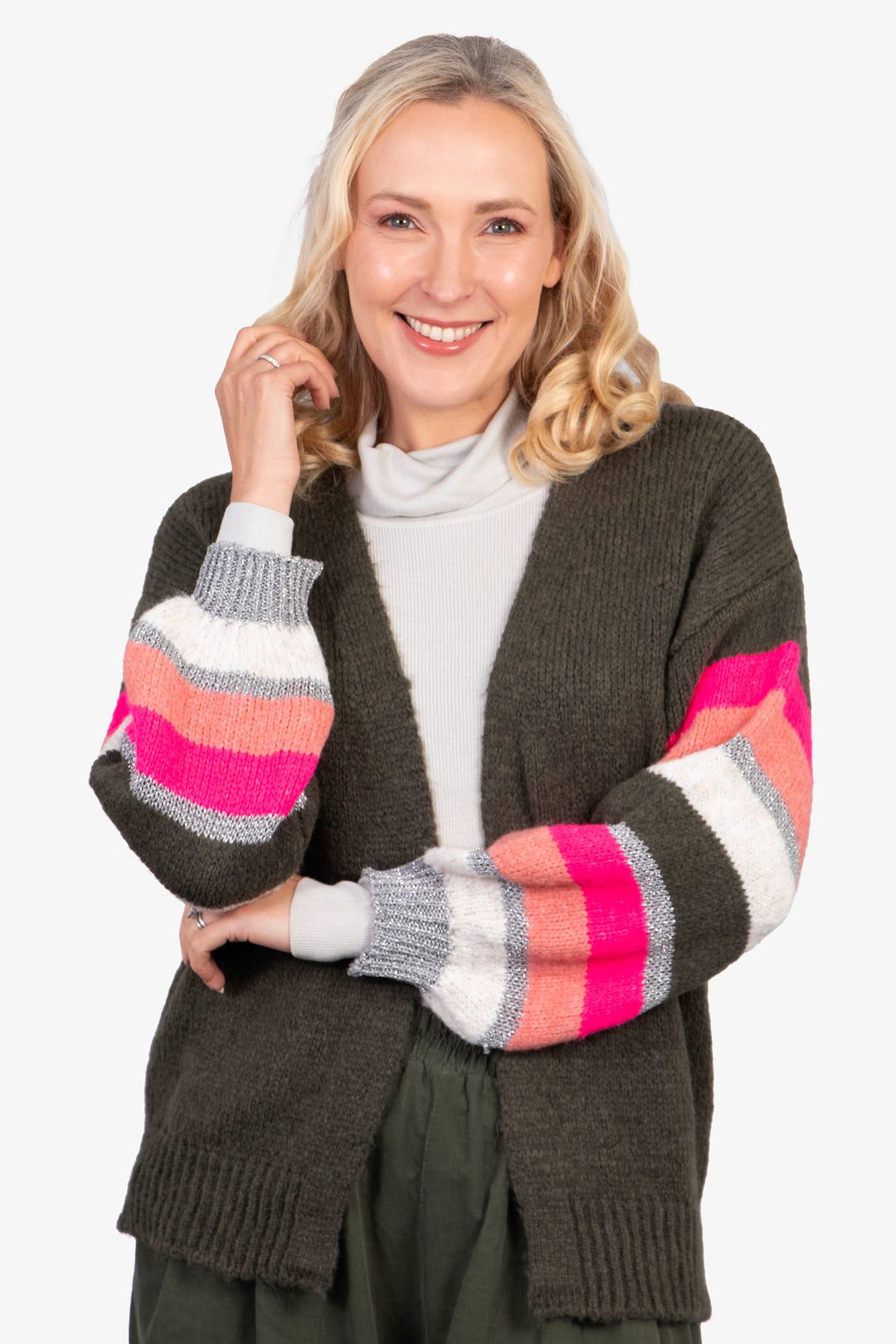 model showing the colourful pink, silver and fuchsia striped sleeves on the khaki knitted cardigan