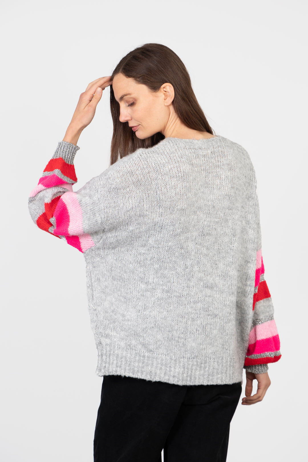 model showing the back of the cardigan which is plain grey