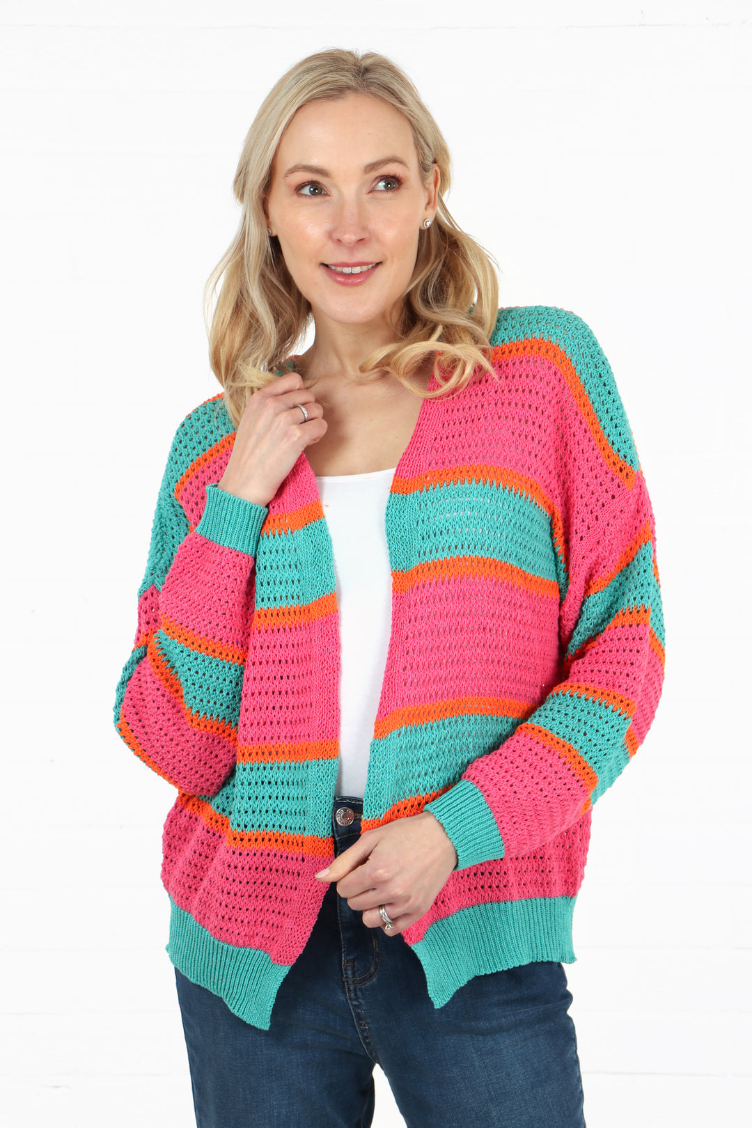 model wearing a cotton open front pink, turquoise and orange striped cardigan