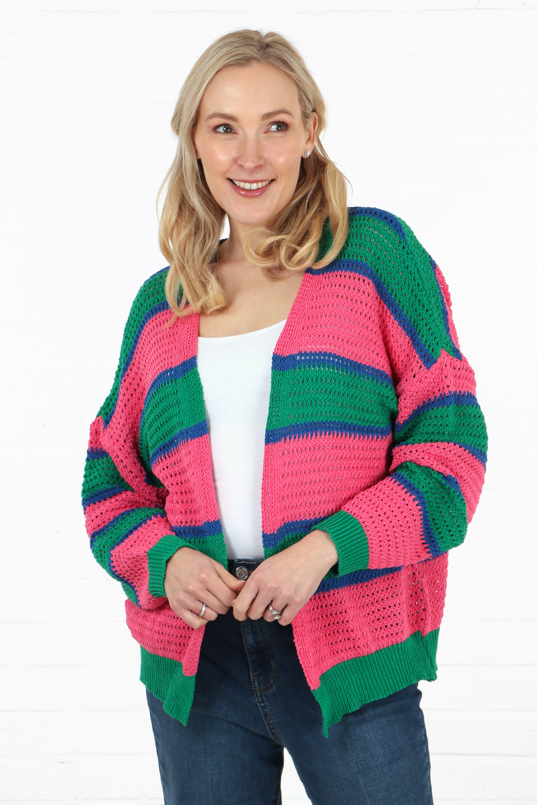model wearing a pink, green and blue striped cotton open front cardigan