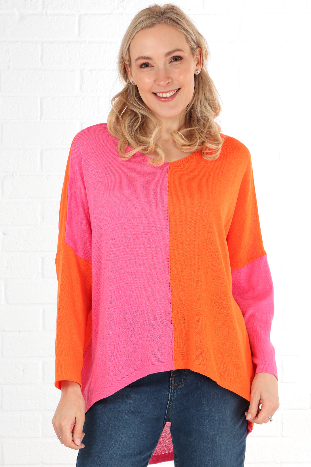 model showing the front of the two tone pink and orange cotton jumper