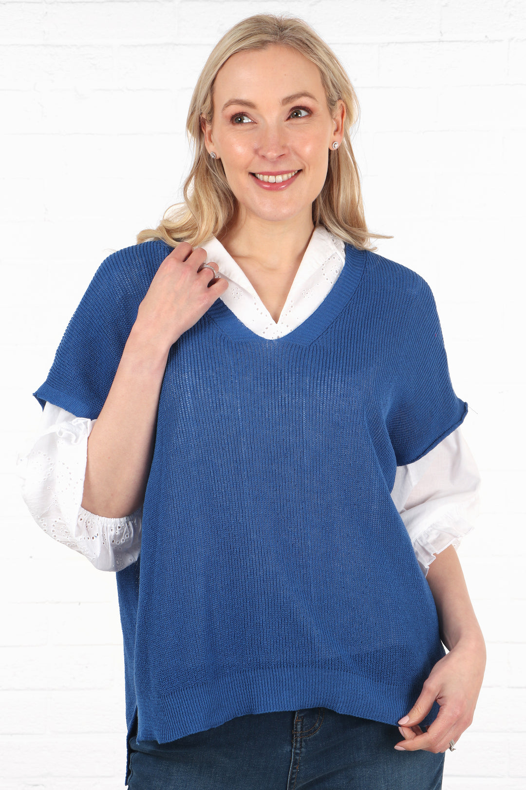 model wearing a blue cotton fine knit pullover tank top jumper