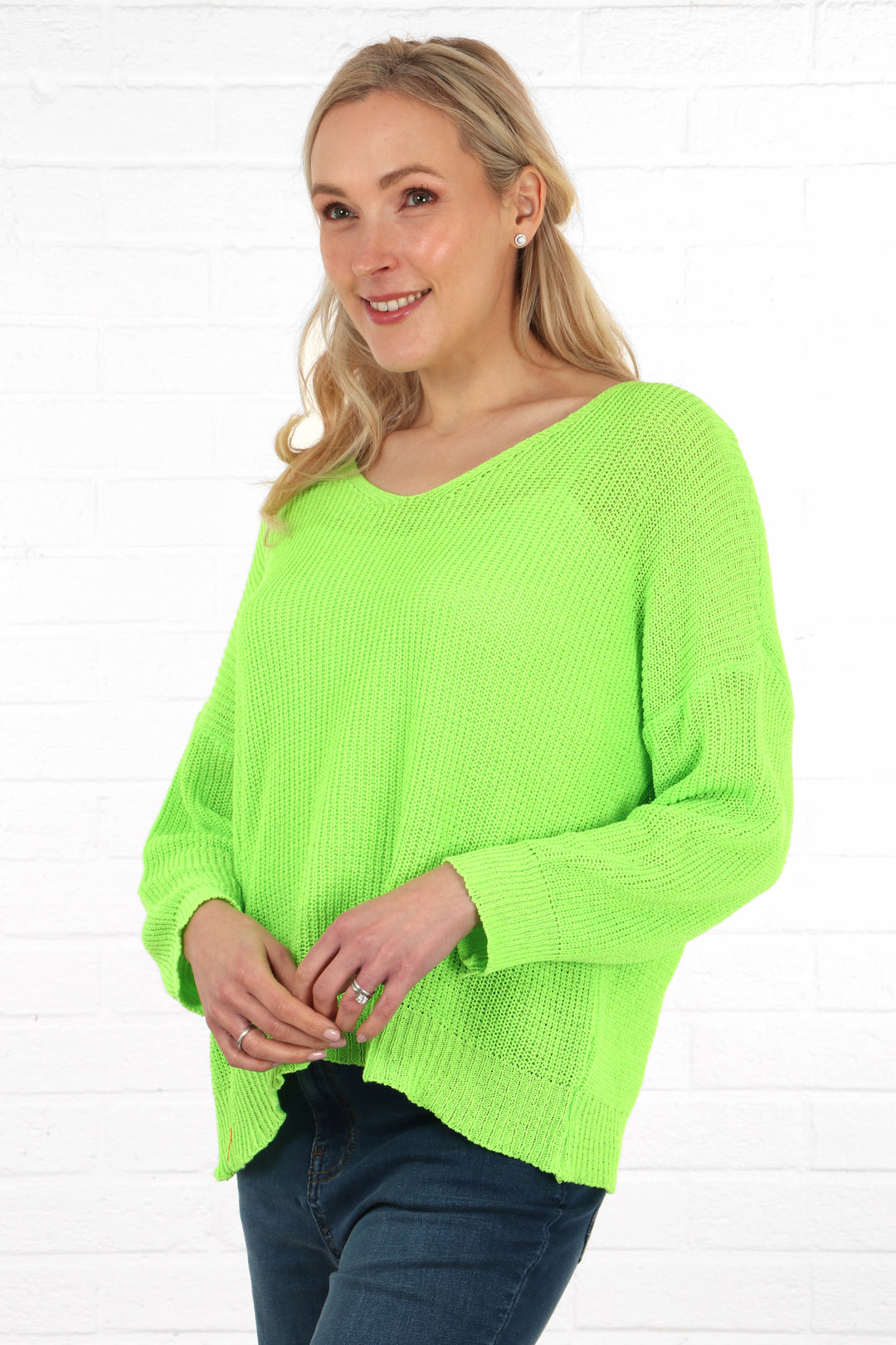 neon lime green cotton knitted jumper with a v neck and long sleeves