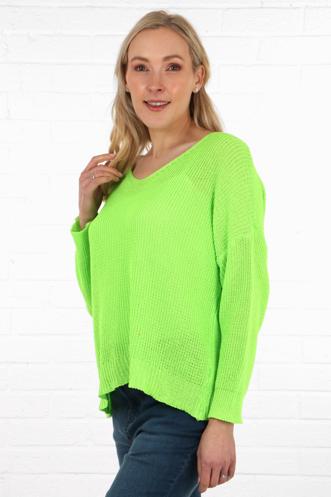 model wearing a v neck long sleeve green cotton knitted jumper