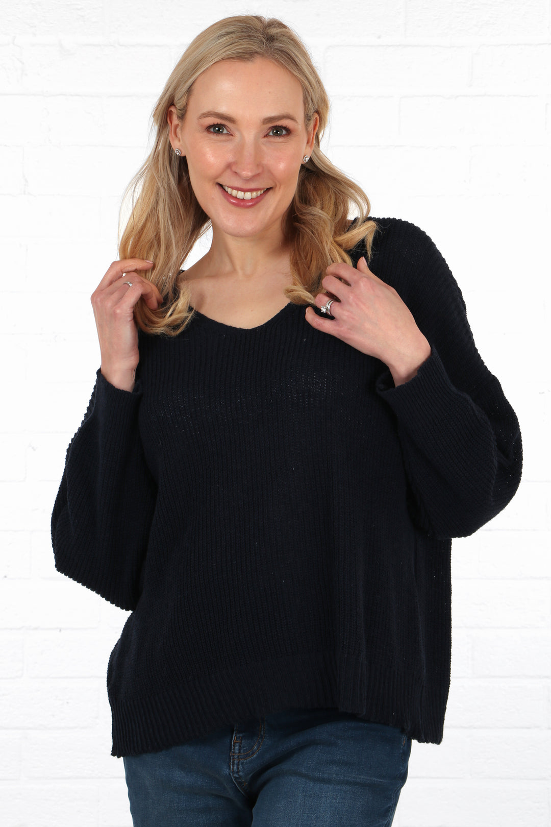 navy blue lightweight cotton knitted jumper in navy blue being worn on a model