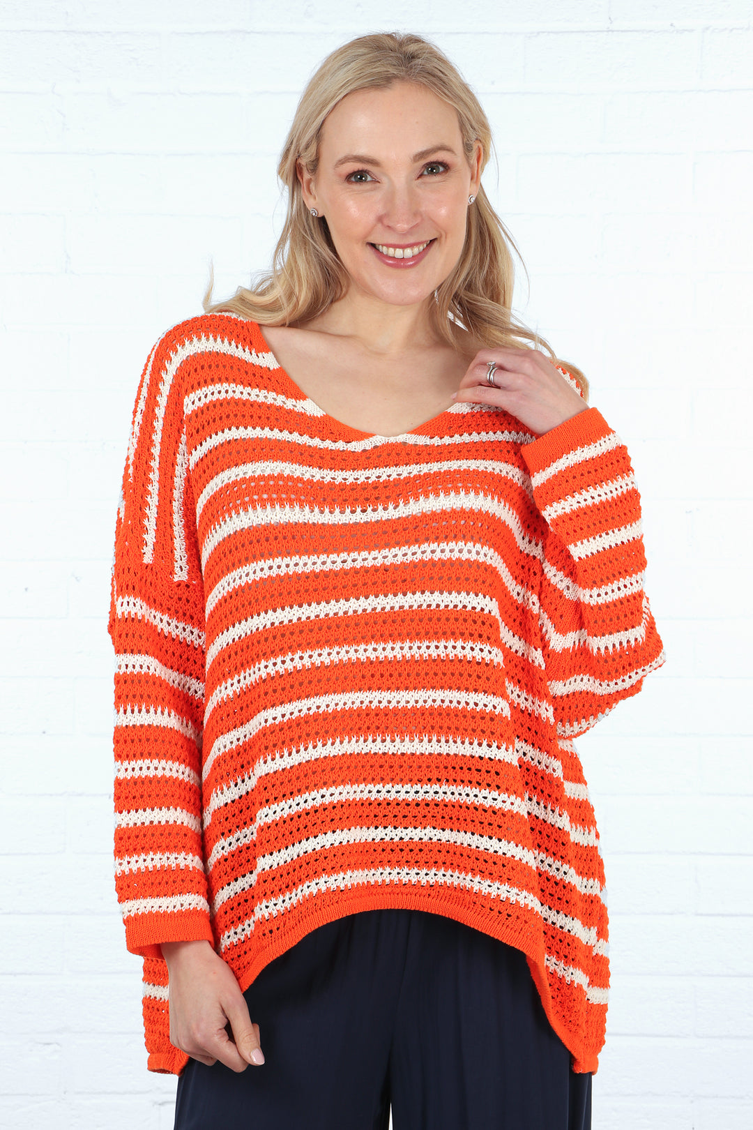 orange and cream striped cotton jumper in an open knit fabric