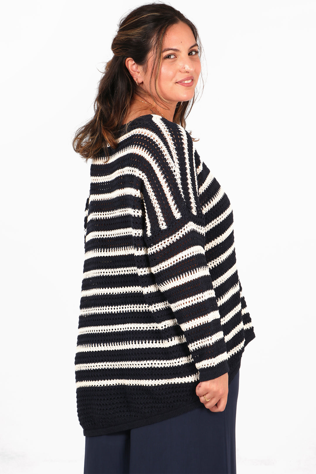 model showing the back of the navy blue striped cotton jumper