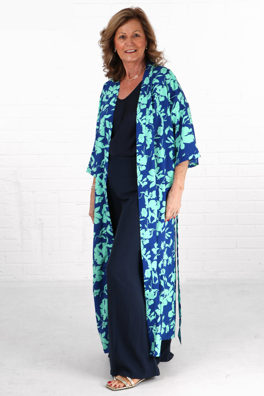 long blue floral print kimono robe with 3/4 sleeves and a waist tie