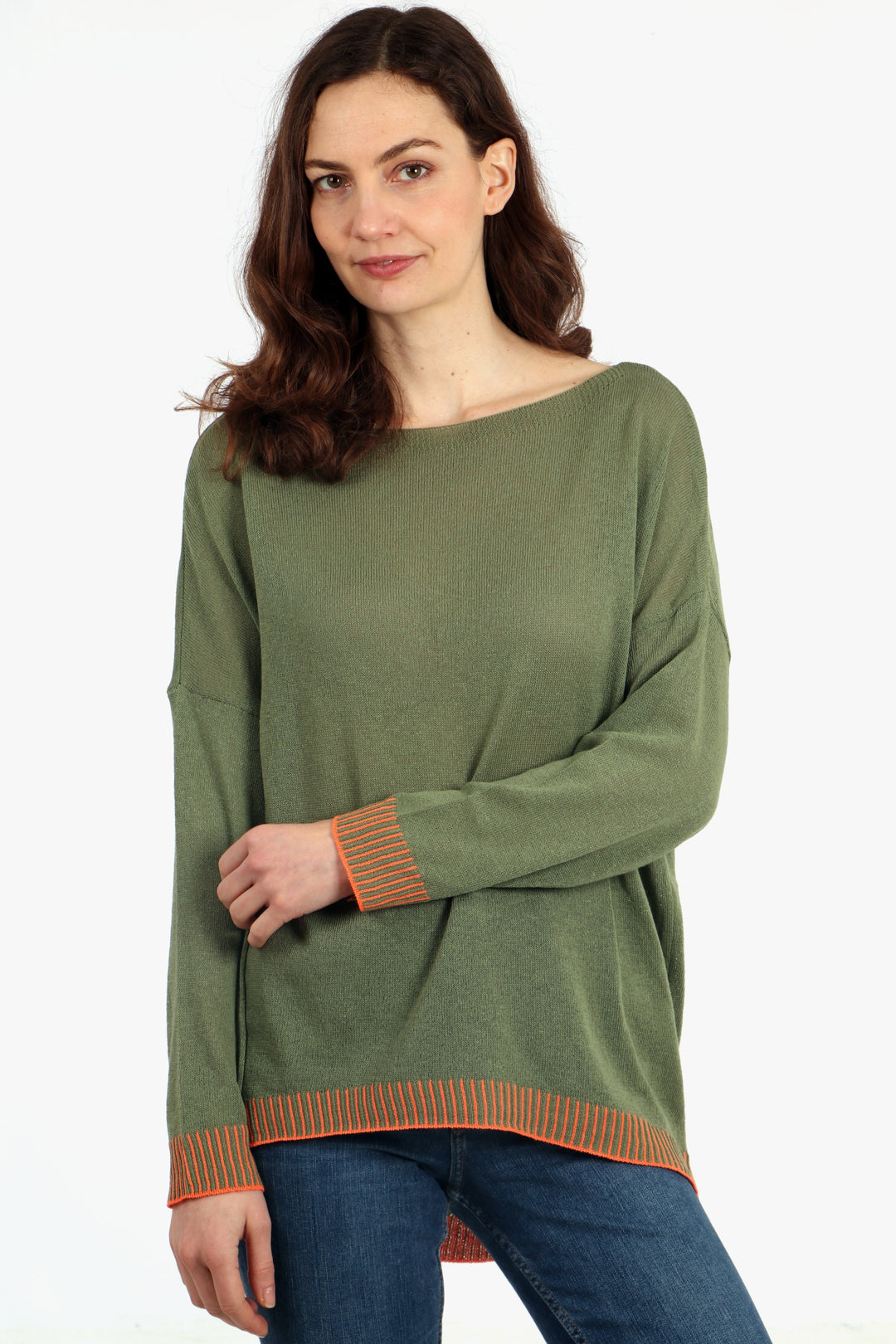 model wearing a long sleeve boat neck cotton jumper in khaki green with a contrasting orange stitched hem and cuff