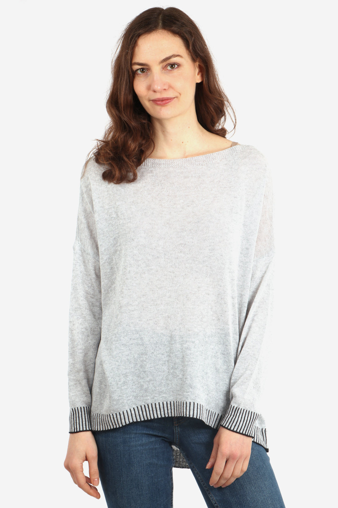 model wearing a long sleeve boat neck cotton jumper in light grey with a contrasting black stitched hem and cuff