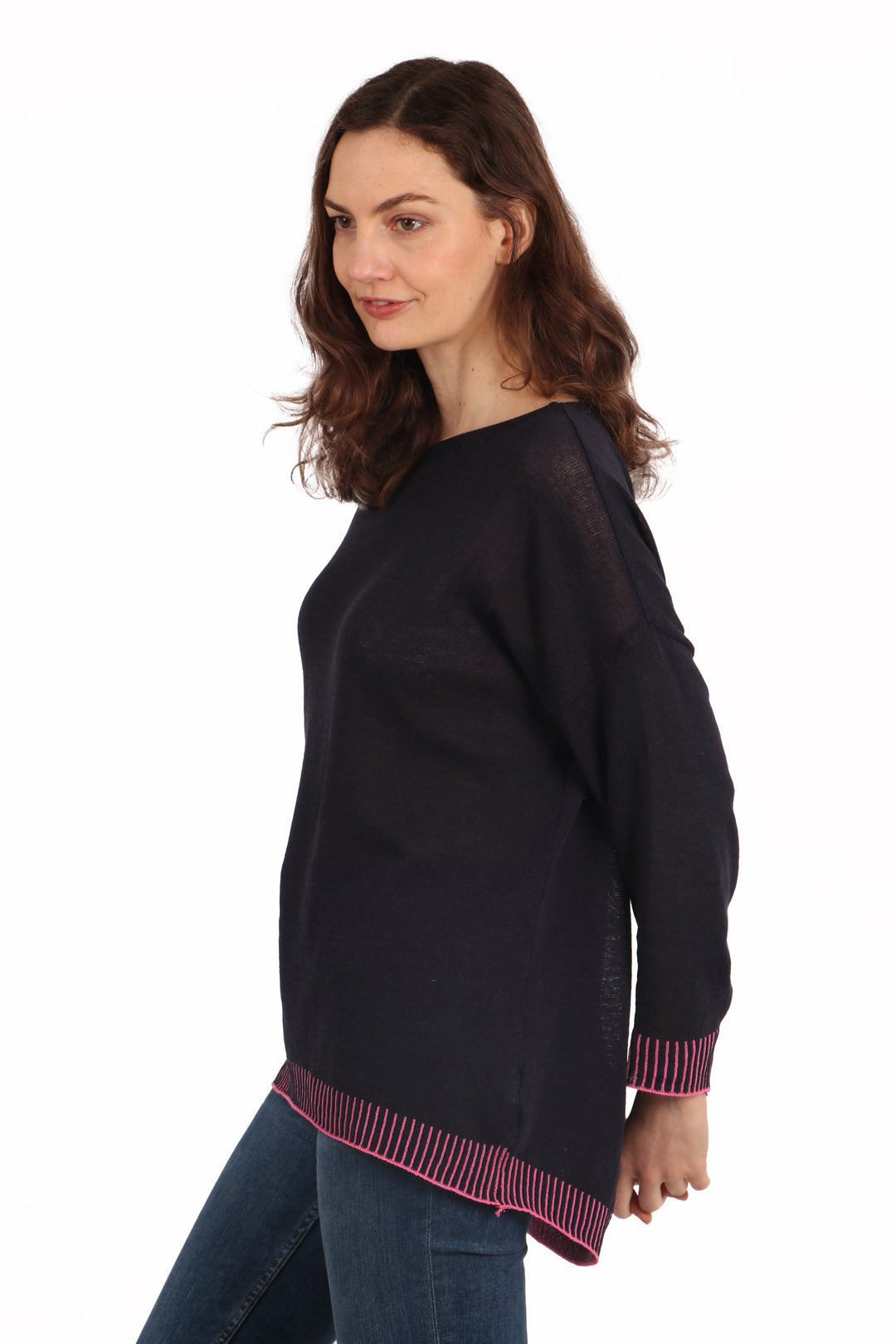 model showing the dip hem feature of this jumper, the item is longer at the back than at the front
