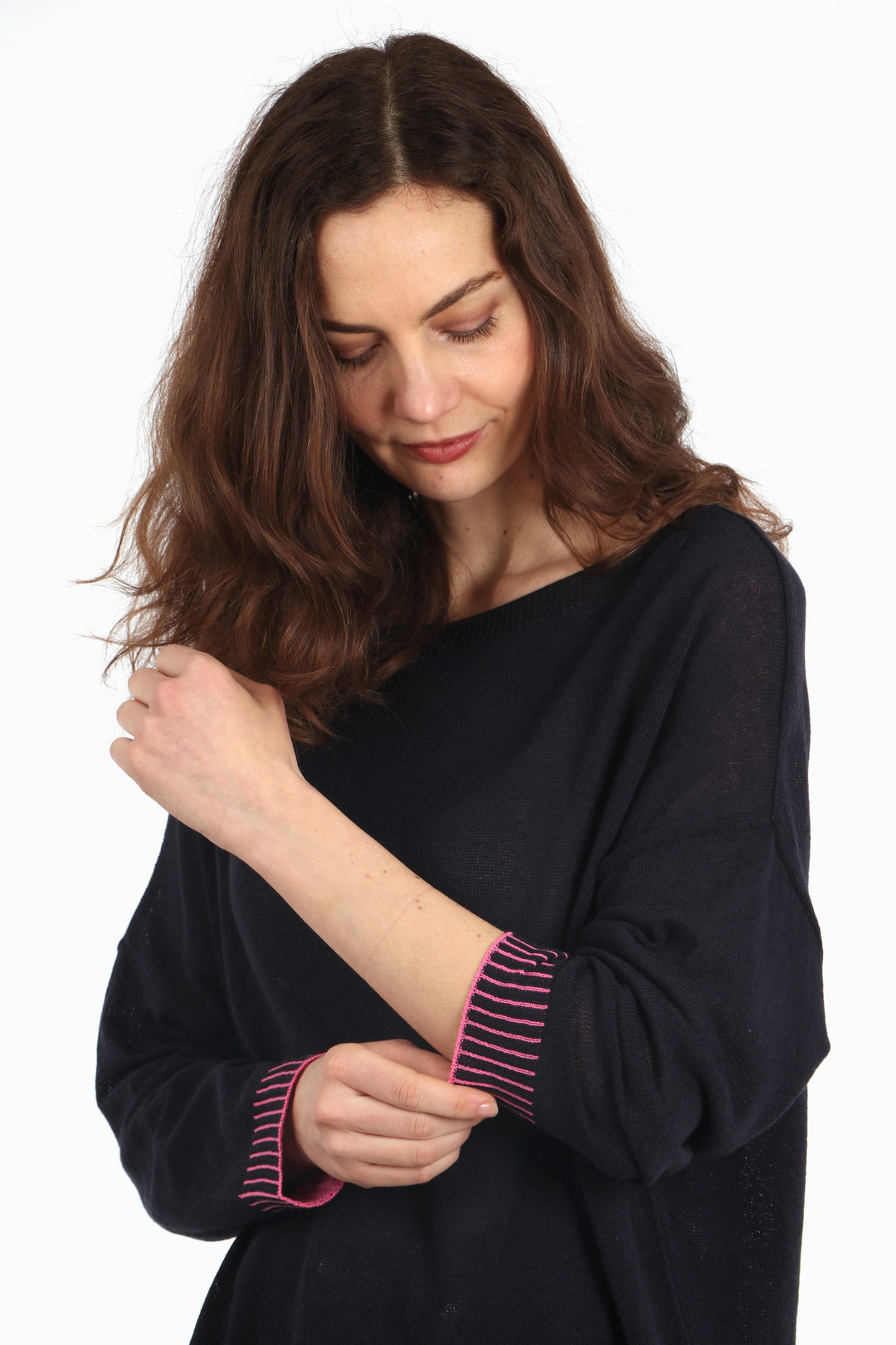close up of the pink contrasting stich pattern on the sleeves of the jumper