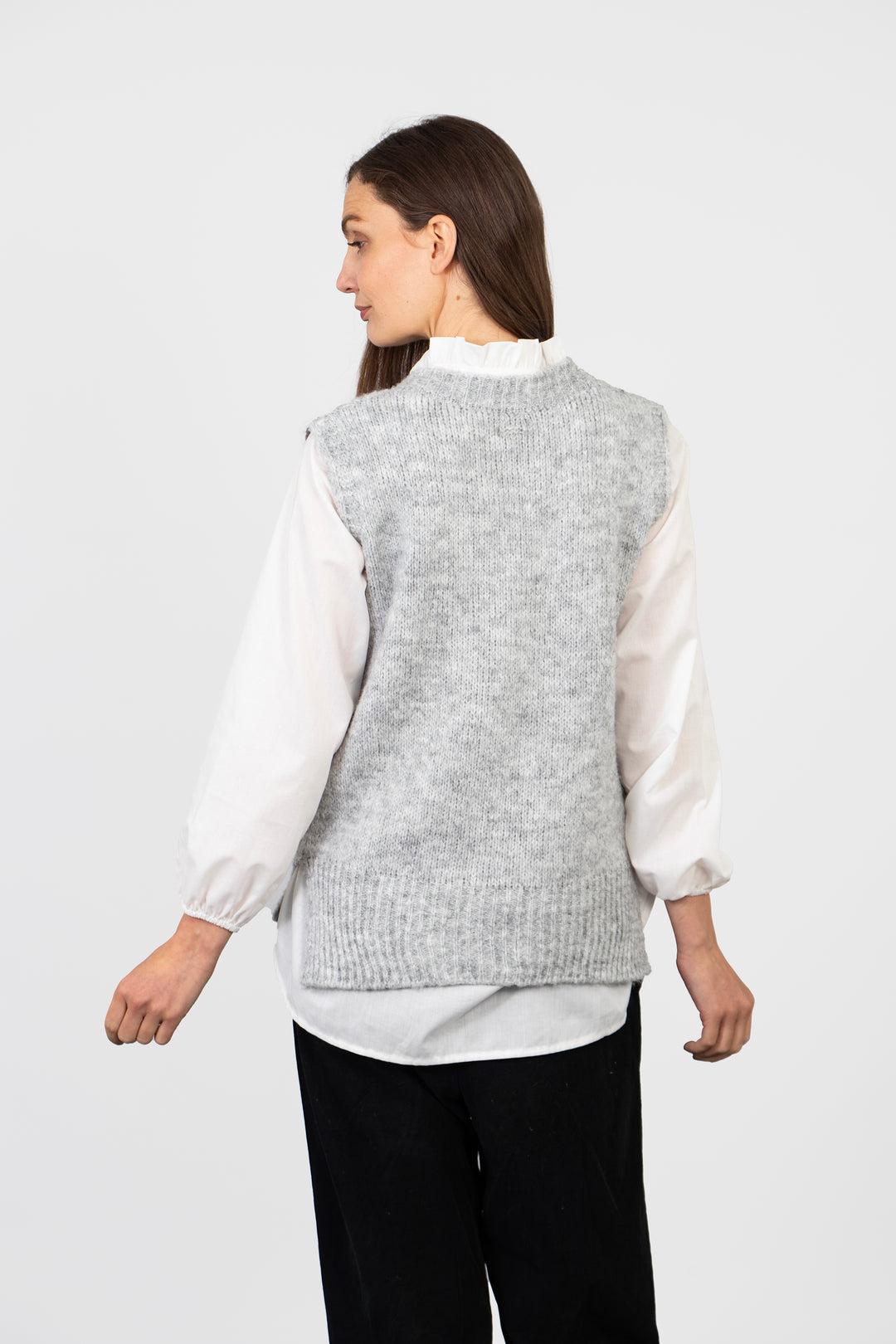 showing the back of the tank top, it is plain light grey and has a round neck at the back