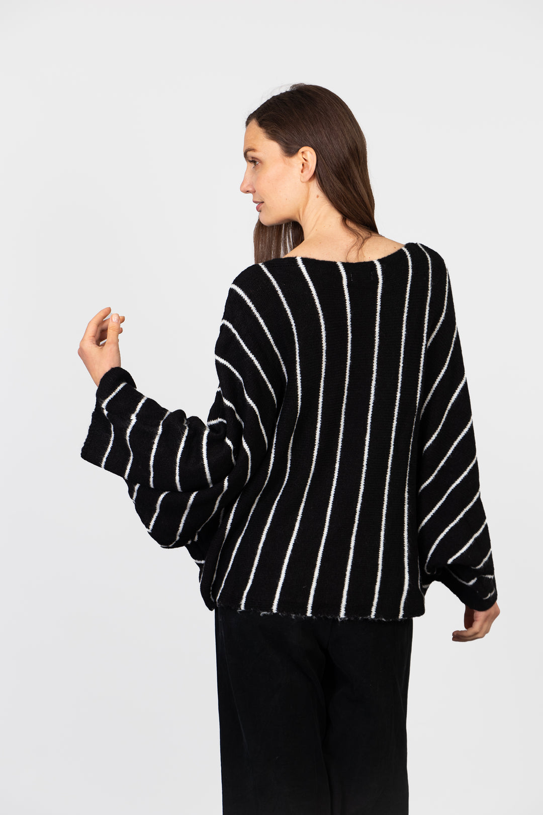 model showing the back of the jumper, the striped design is all over