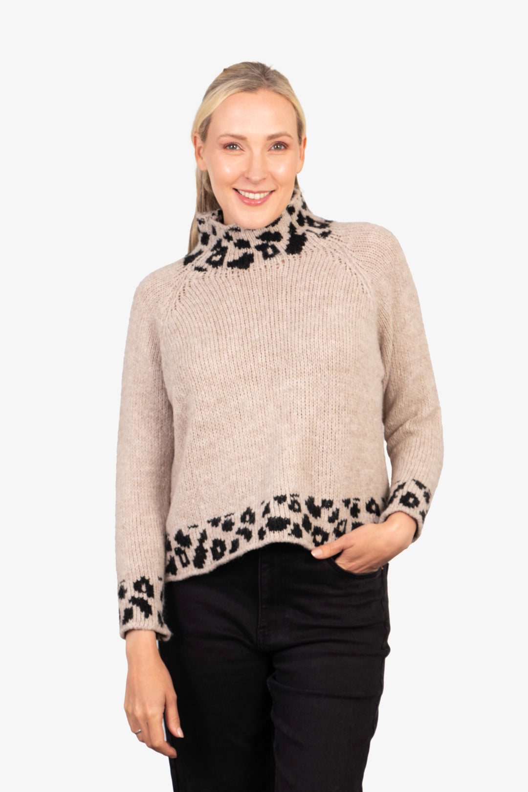 beige long sleeve jumper with a high neck, the jumper features a contrasting black leopard print pattern on the neck, trim and cuffs