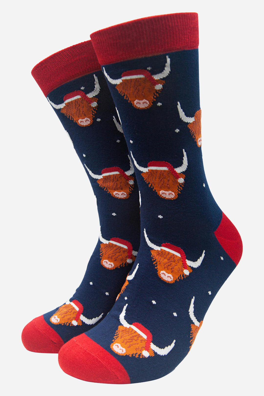 navy blue socks featuring highland cows wearing santa hats