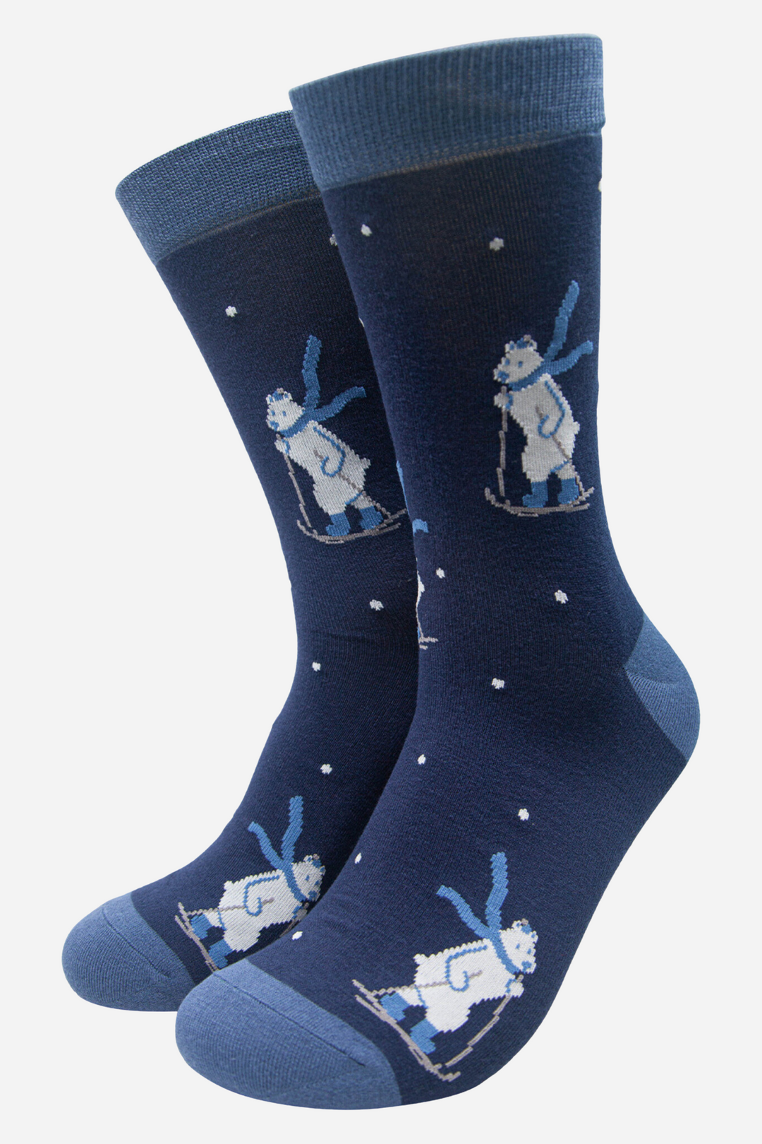 navy blue socks with a pattern of cross country skiing polar bears