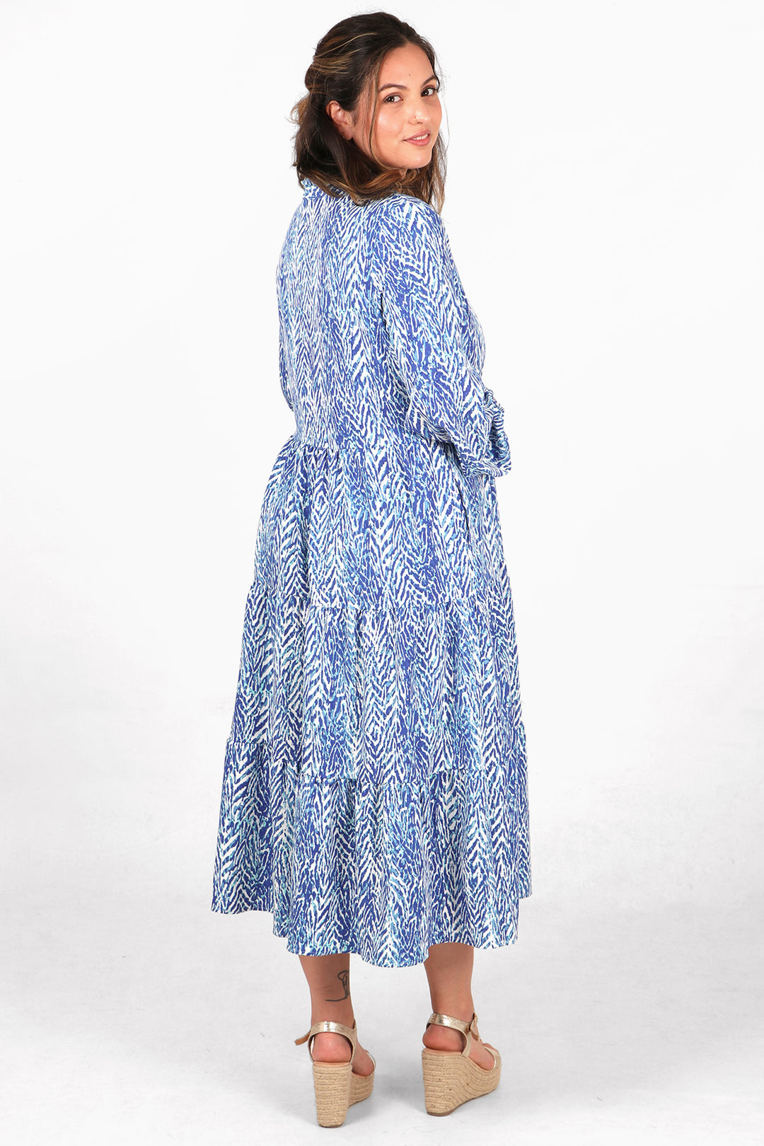 back of the dress, showing the midi length hem line and all over blue and white chevron pattern