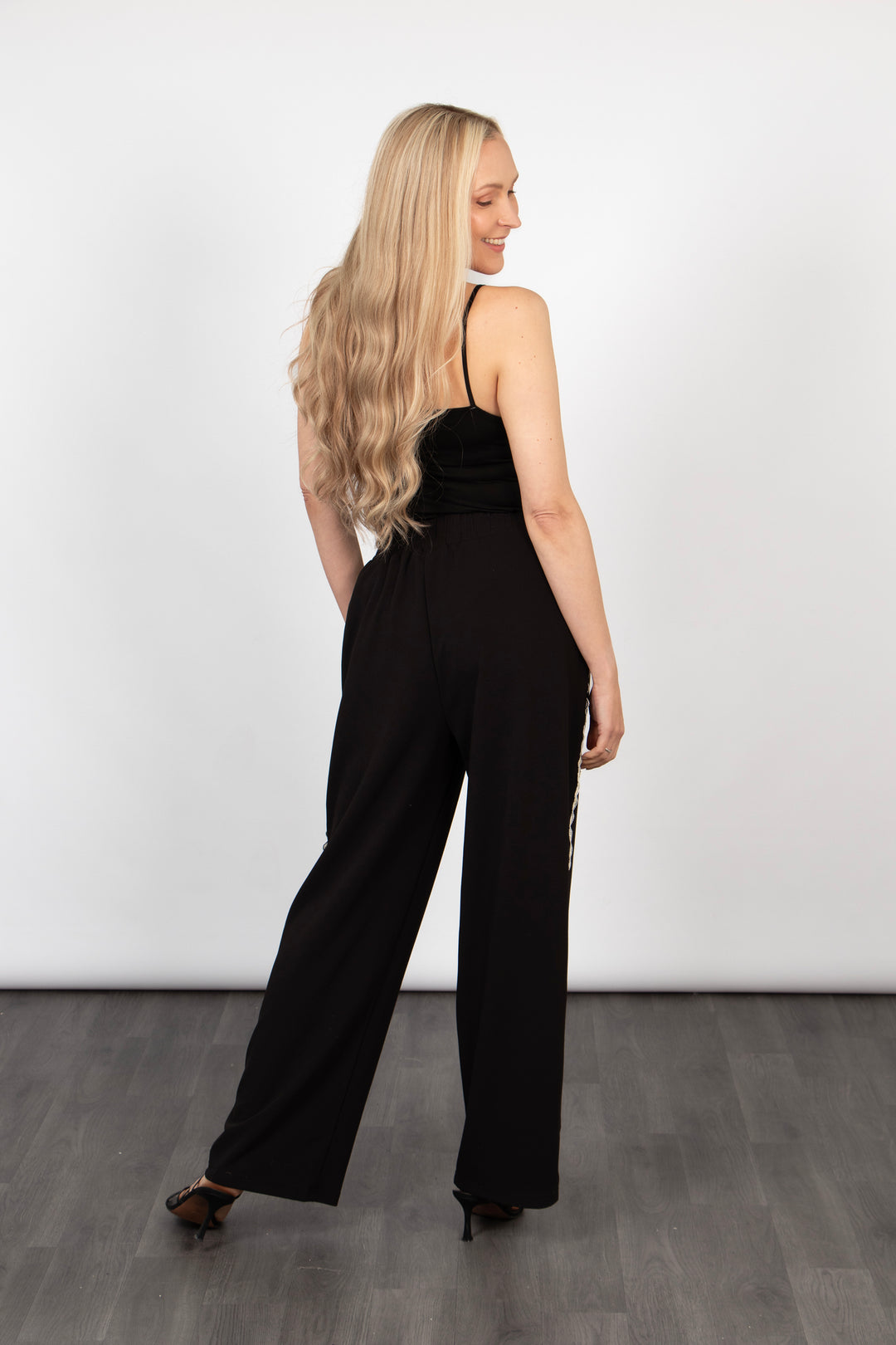 model showing the back of the trousers which are plain black