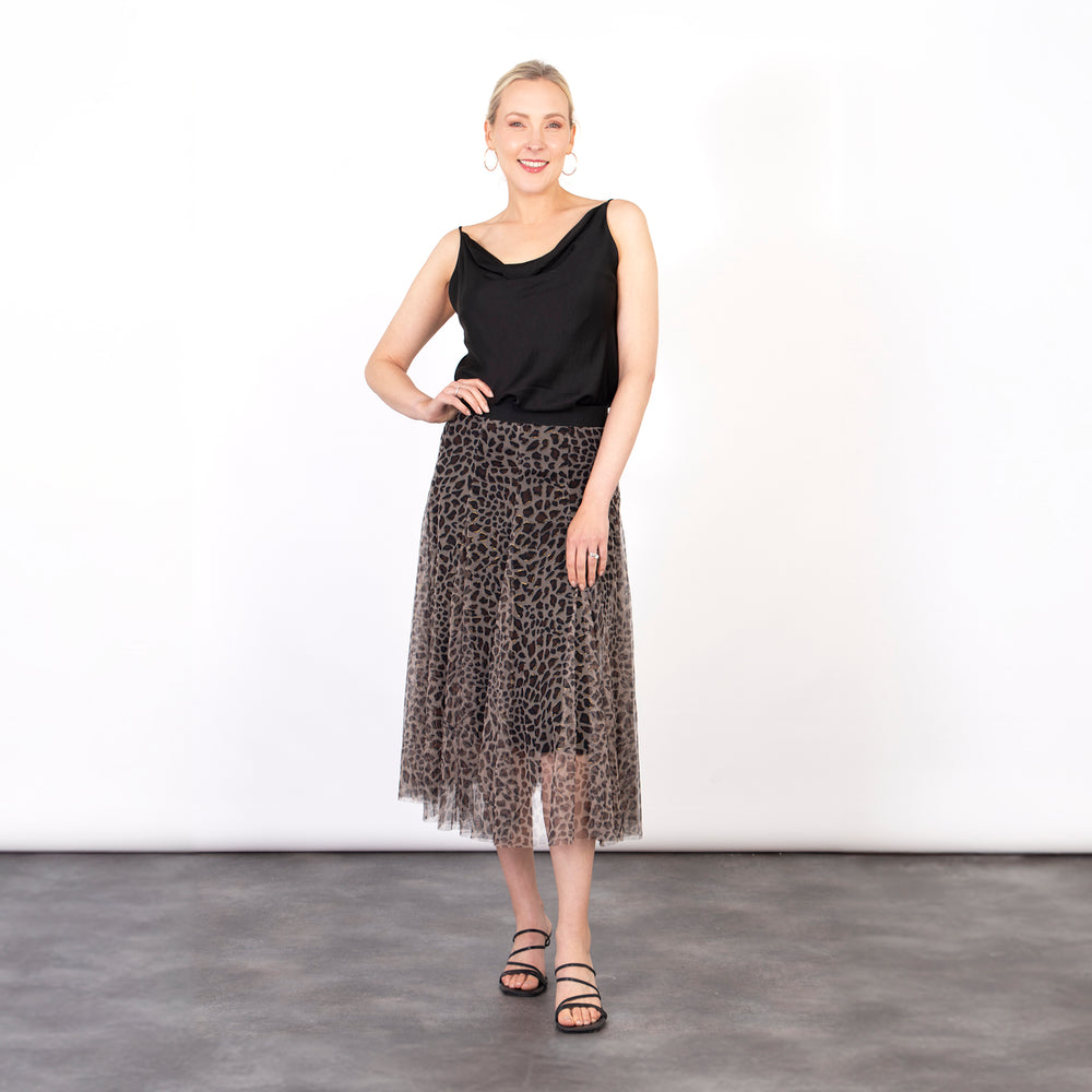 model wearing a tulle midi skirt with a neutral leopard print layer and elasticated waist