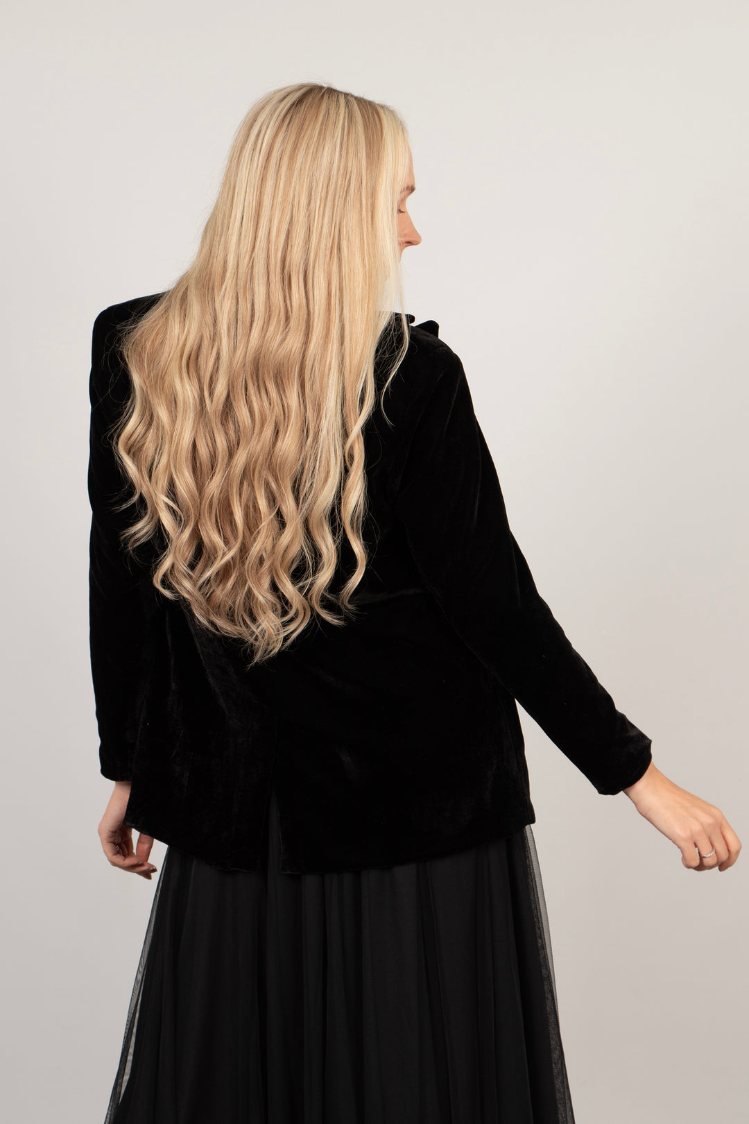 model showing the back of the blazer, showing a small split at the back