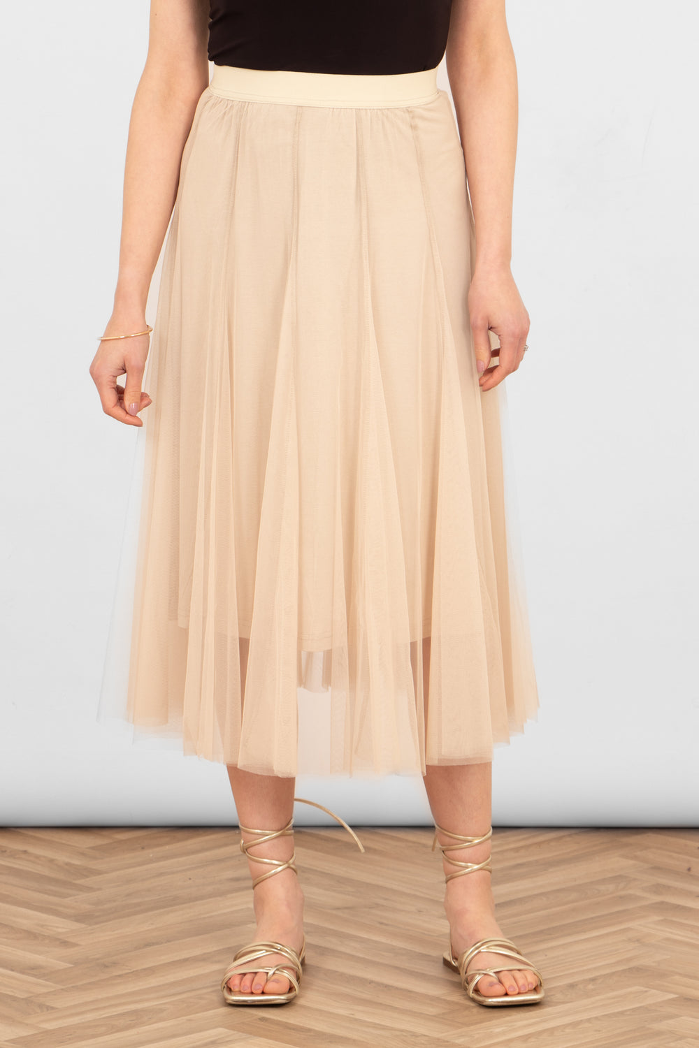 close up of the cream tulle midi skirt, showing the layered design, underskirt and elasticated waistband