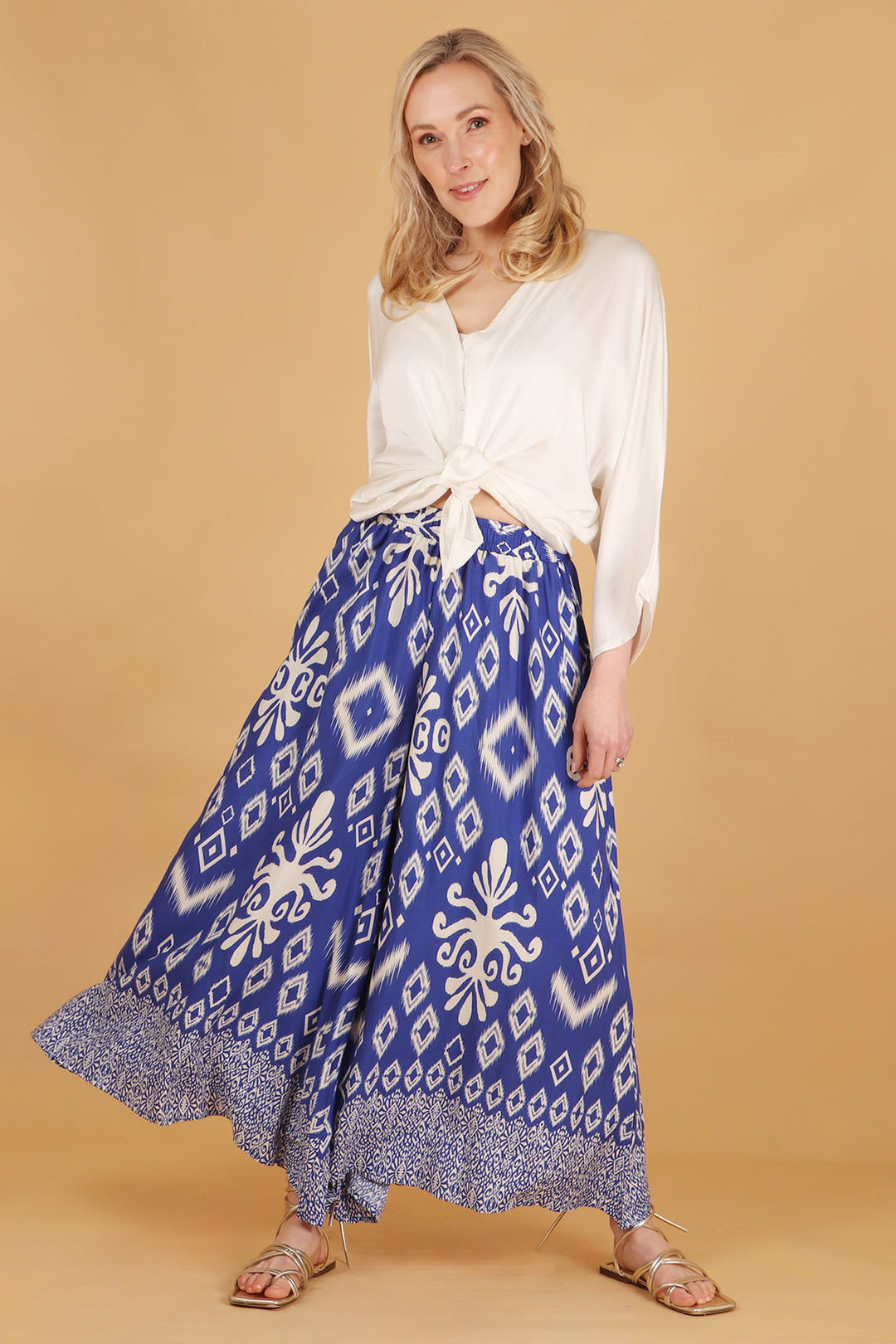 model wearing a pair of lightweight palazzo pants with an elasticated waist and wide legs