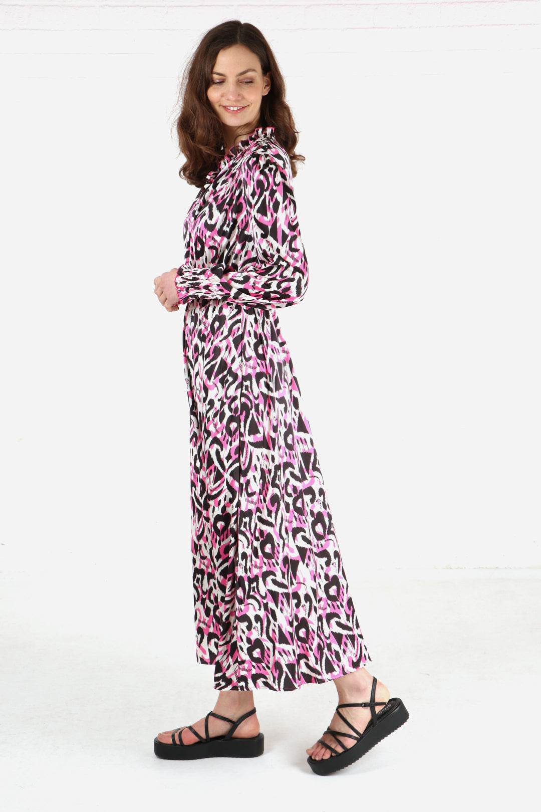 model wearing an abstract ikat print long pink midaxi dress