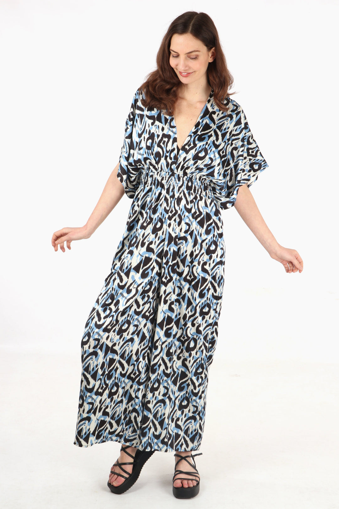 model showing the wide flared leg design of this summer jumpsuit