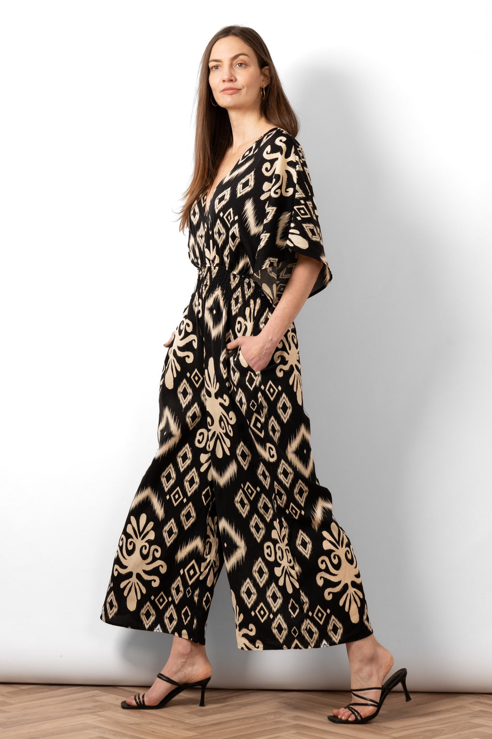 lyra-deep-v-neck-jumpsuit-black-ikat-side-view-wide-leg