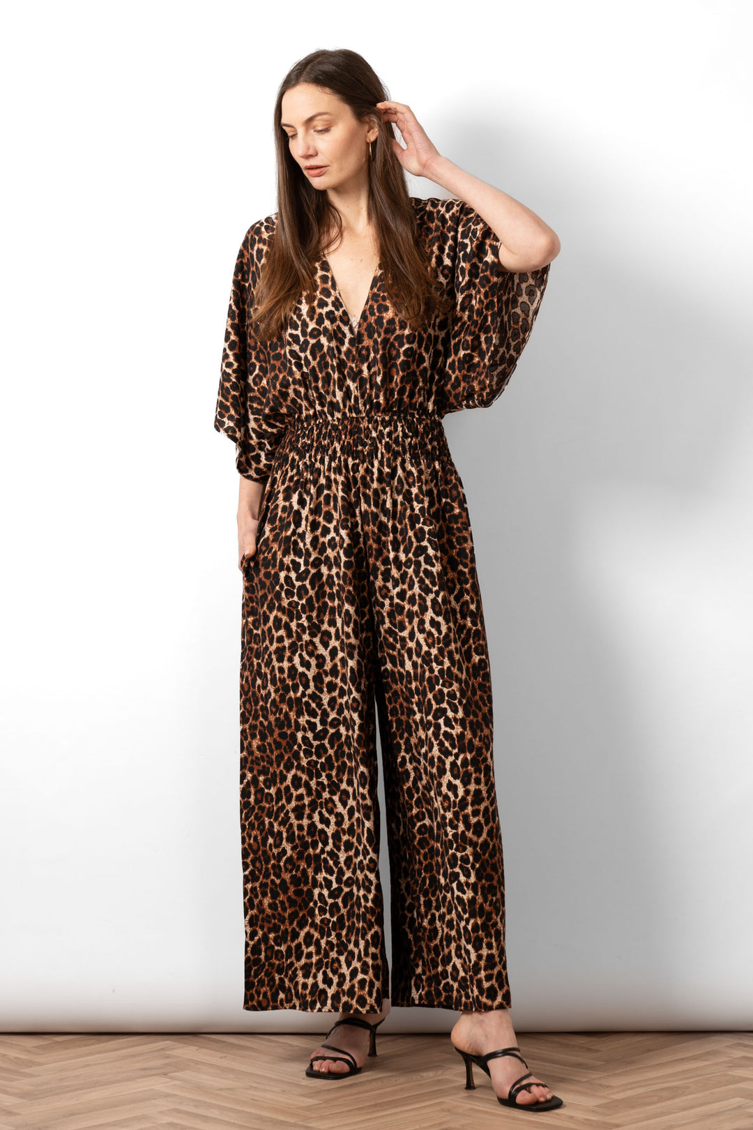 lyra-deep-v-neck-jumpsuit-neutral-leopard-print-front-view-on-model