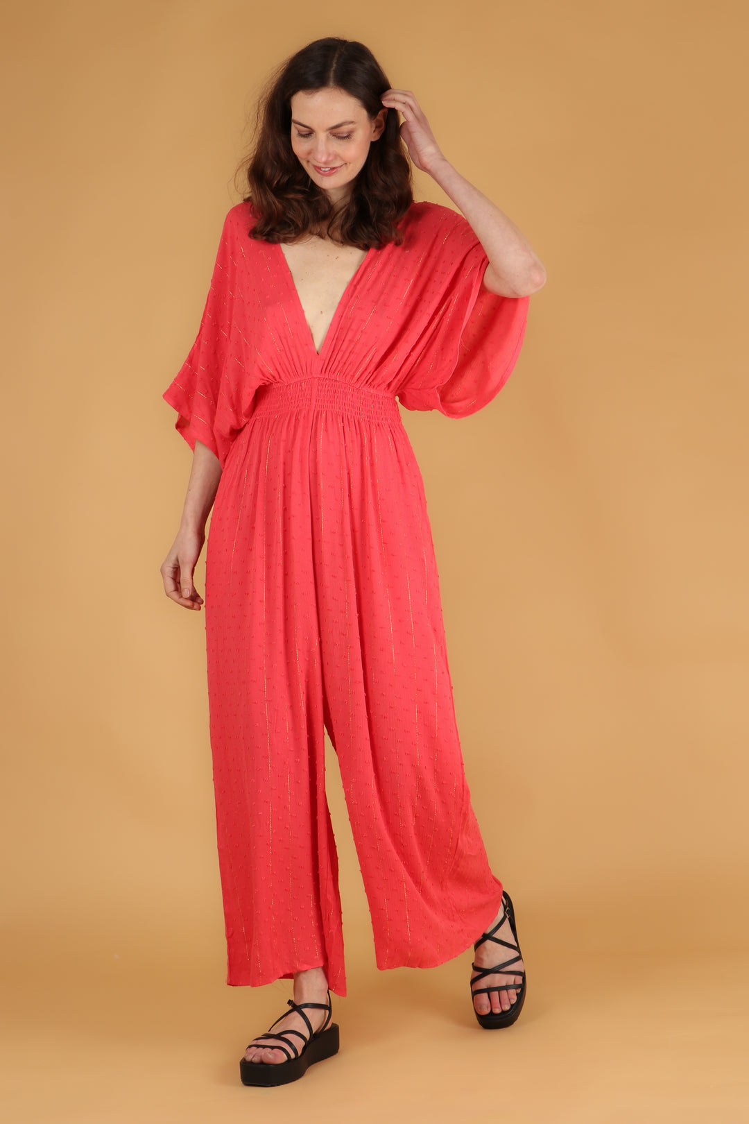 shirred waist wide leg jumpsuit with short angel sleeves and in coral 