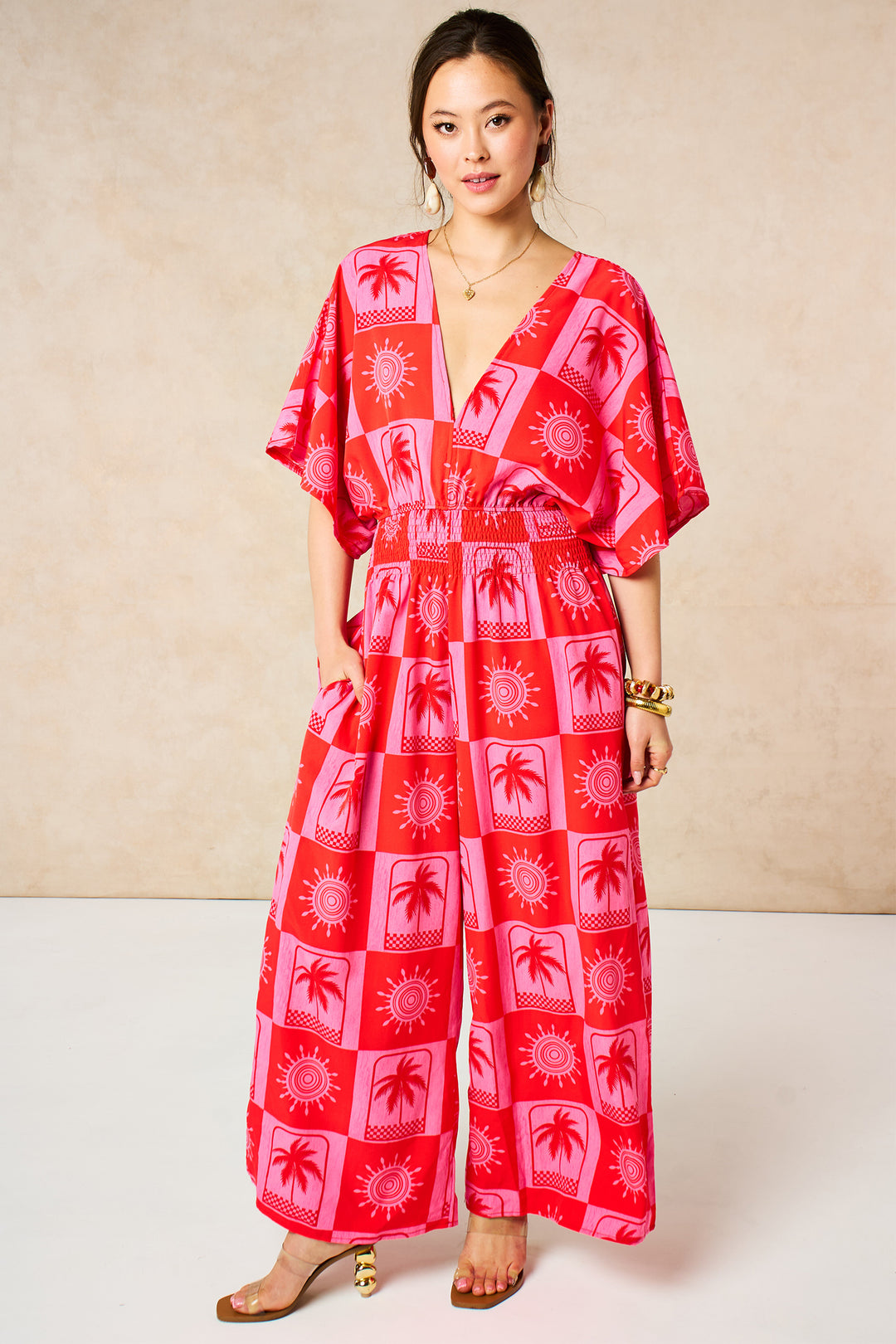 Palm-Tree-Checkerboard-V-Neck-Jumpsuit-in-Hot-Pink