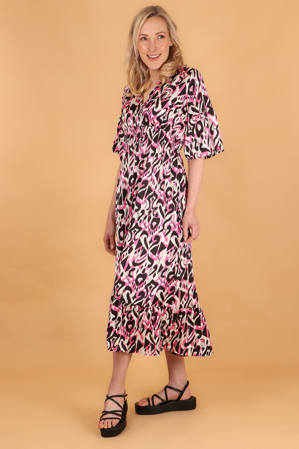 pink maxi dress with fluted sleeves and an shirred elasticated waist in an all over pink ikat pattern