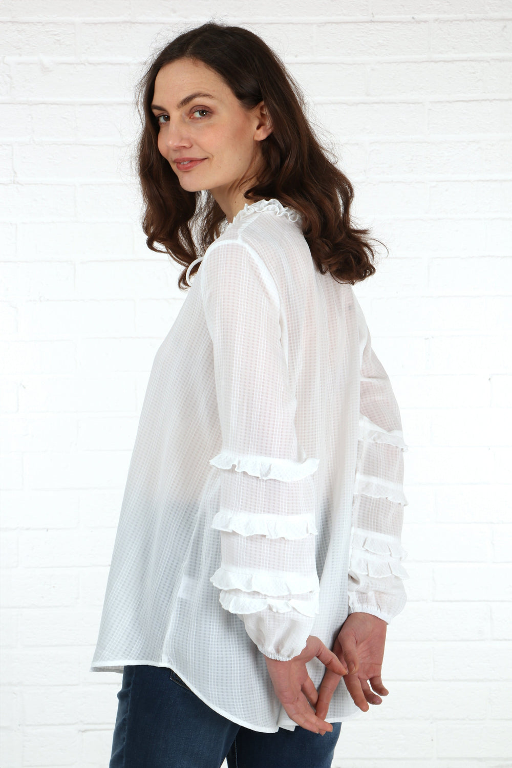 model showing the frill details on the sleeves of the lightweight blouse