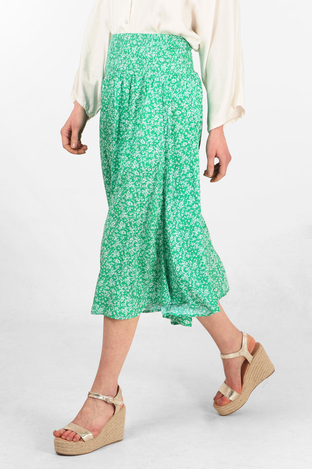 close up of the green ditsy floral pattern and the shirred waist on the culottes
