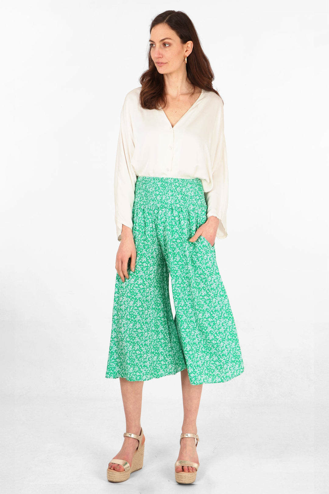 model wearing green and white ditsy floral pattern wide leg culottes