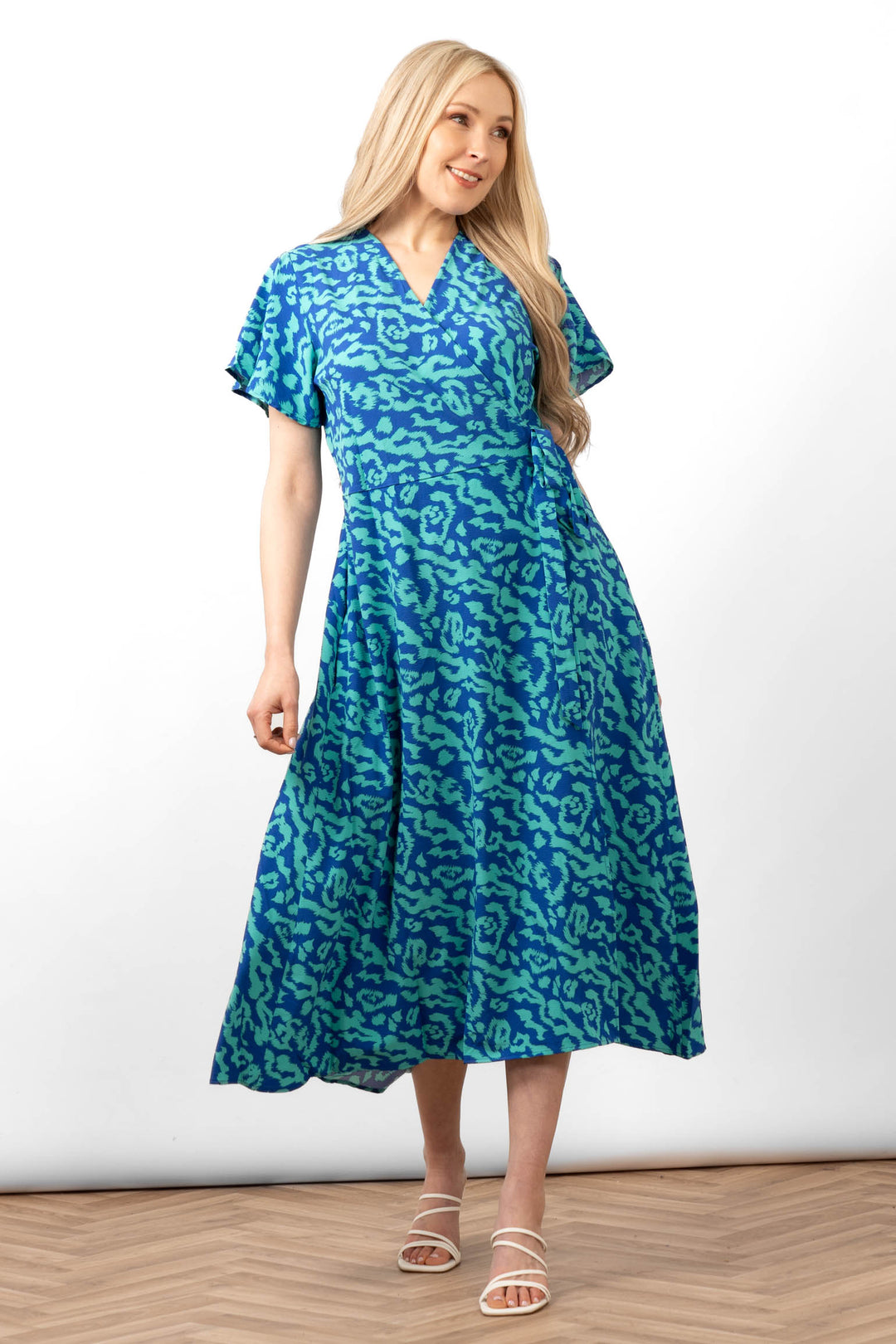 addie-short-sleeve-wrap-dress-blue-animal-print-worn-by-model-front-view-v-neck