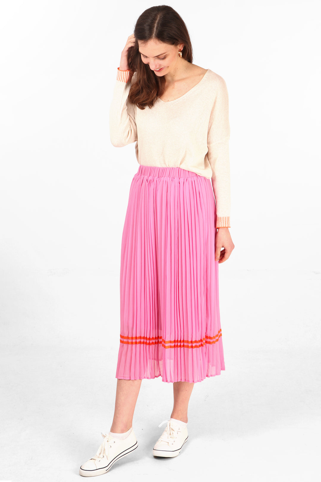 pink pleated midi skirt with orange ribbon trim