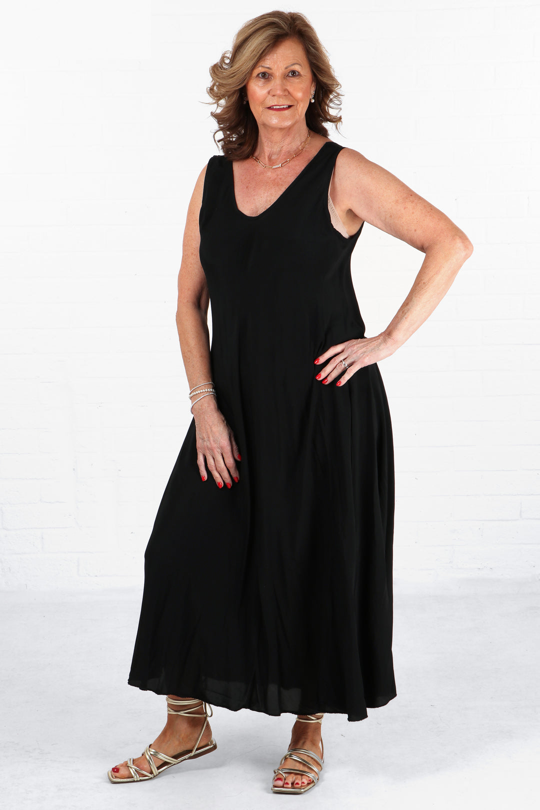 model wearing a black summer maxi dress with v neck and a loose fitting aline shape