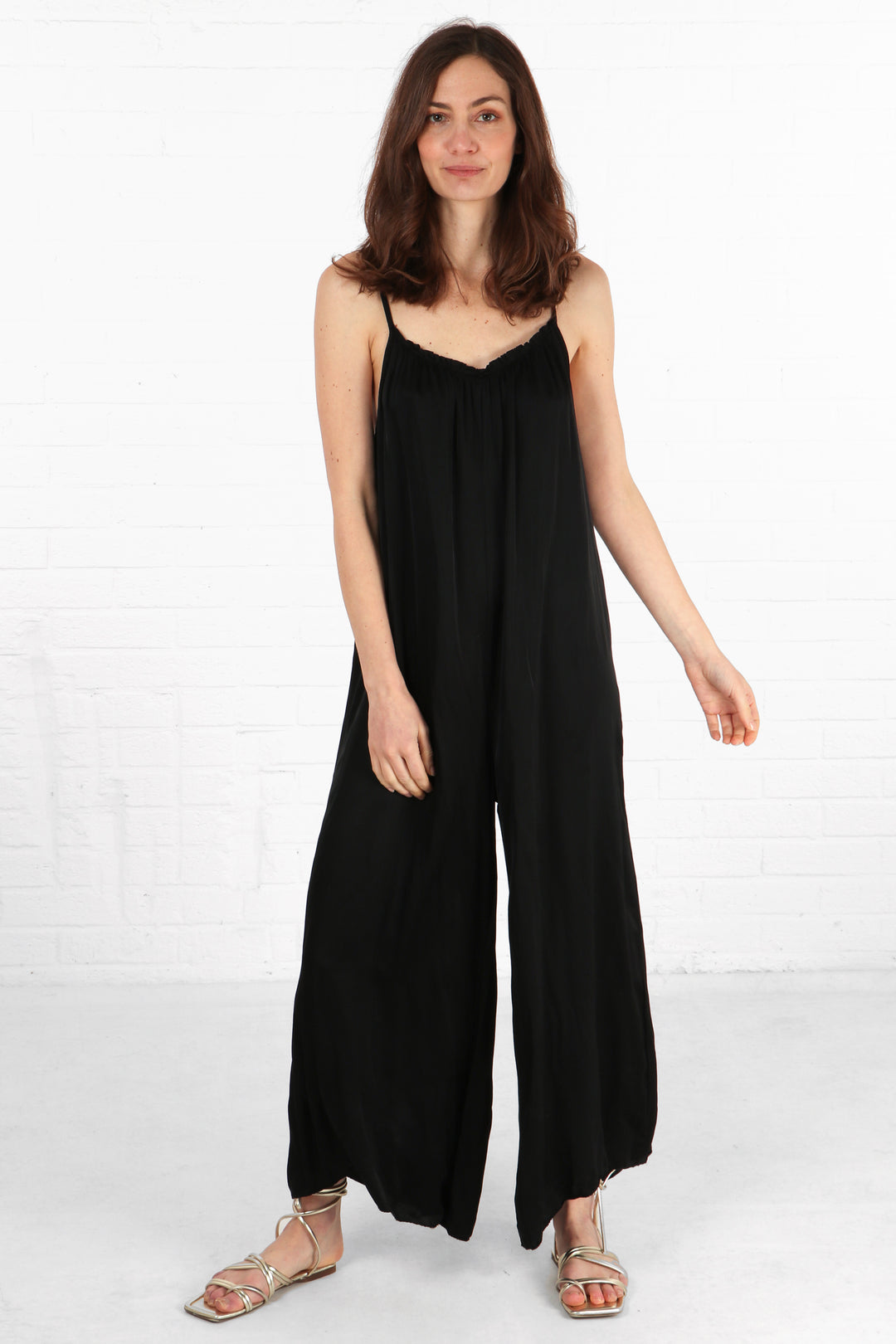 silky textured wide leg maxi length jumpsuit with thin spaghetti straps