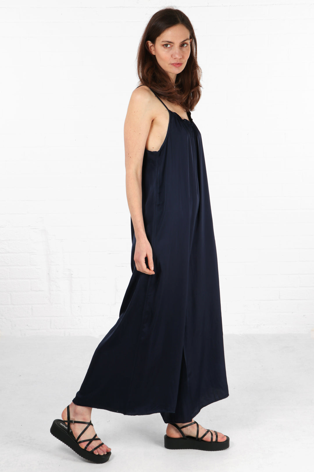 faux silk navy blue jumpsuit with spaghetti straps and wide maxi length trouser legs
