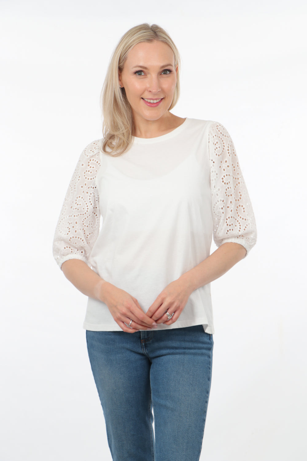 model wearing a plain white cotton top with 3/4 elbow length puff sleeves