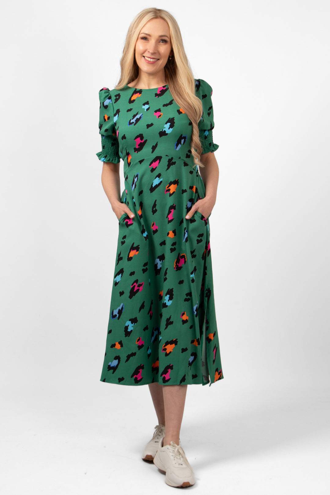 hazel-midi-tea-dress-green-large-leopard-print-on-model-front-view-side-pockets