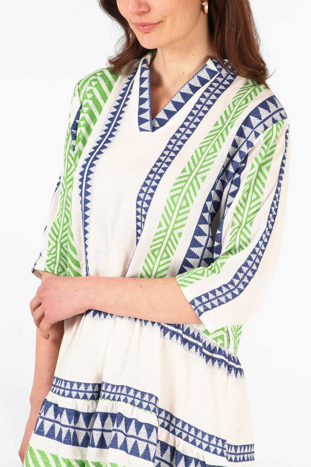 close up of the green and blue aztec pattern on the cotton mini dress