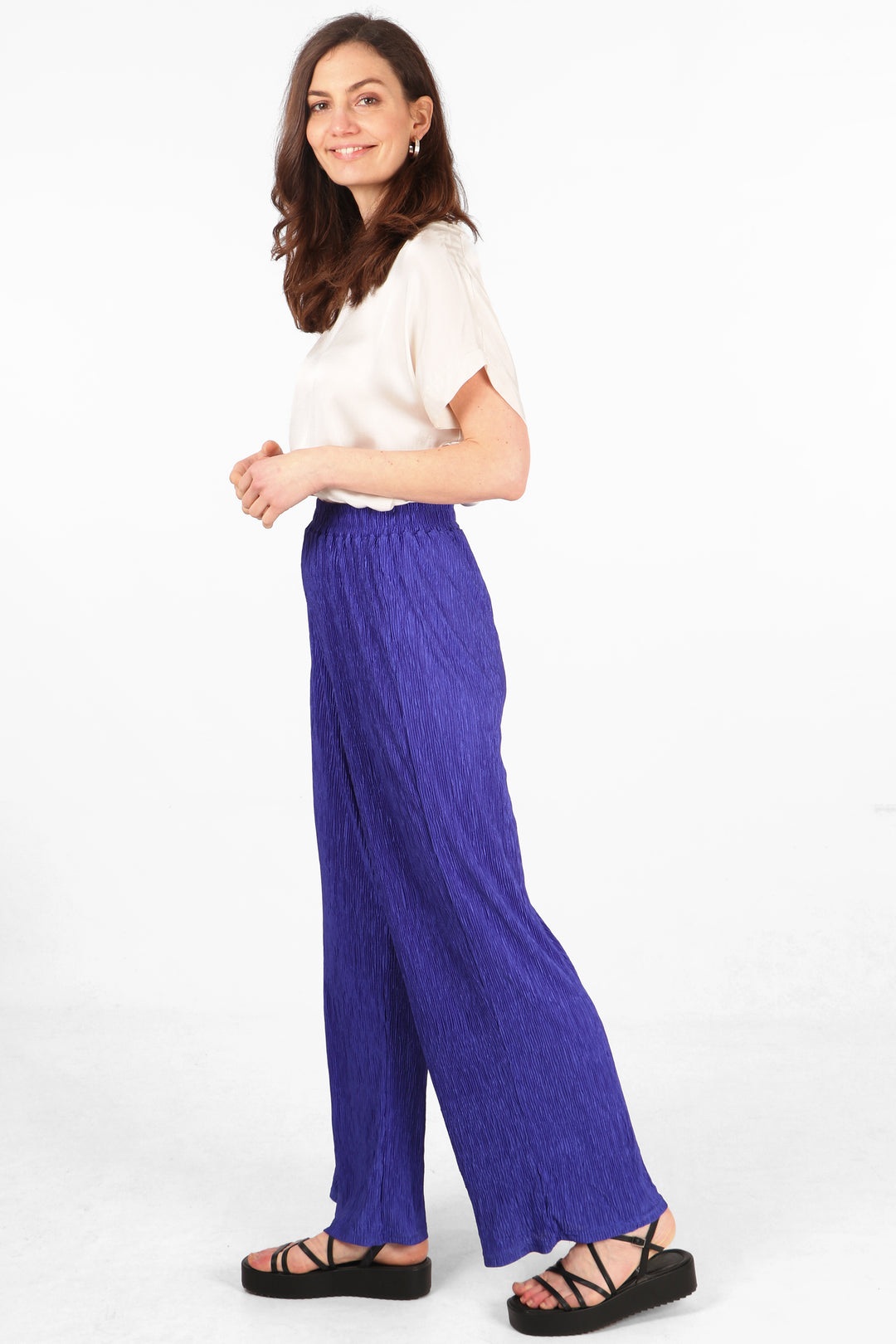 model wearing crinkled plisse royal blue summer trousers