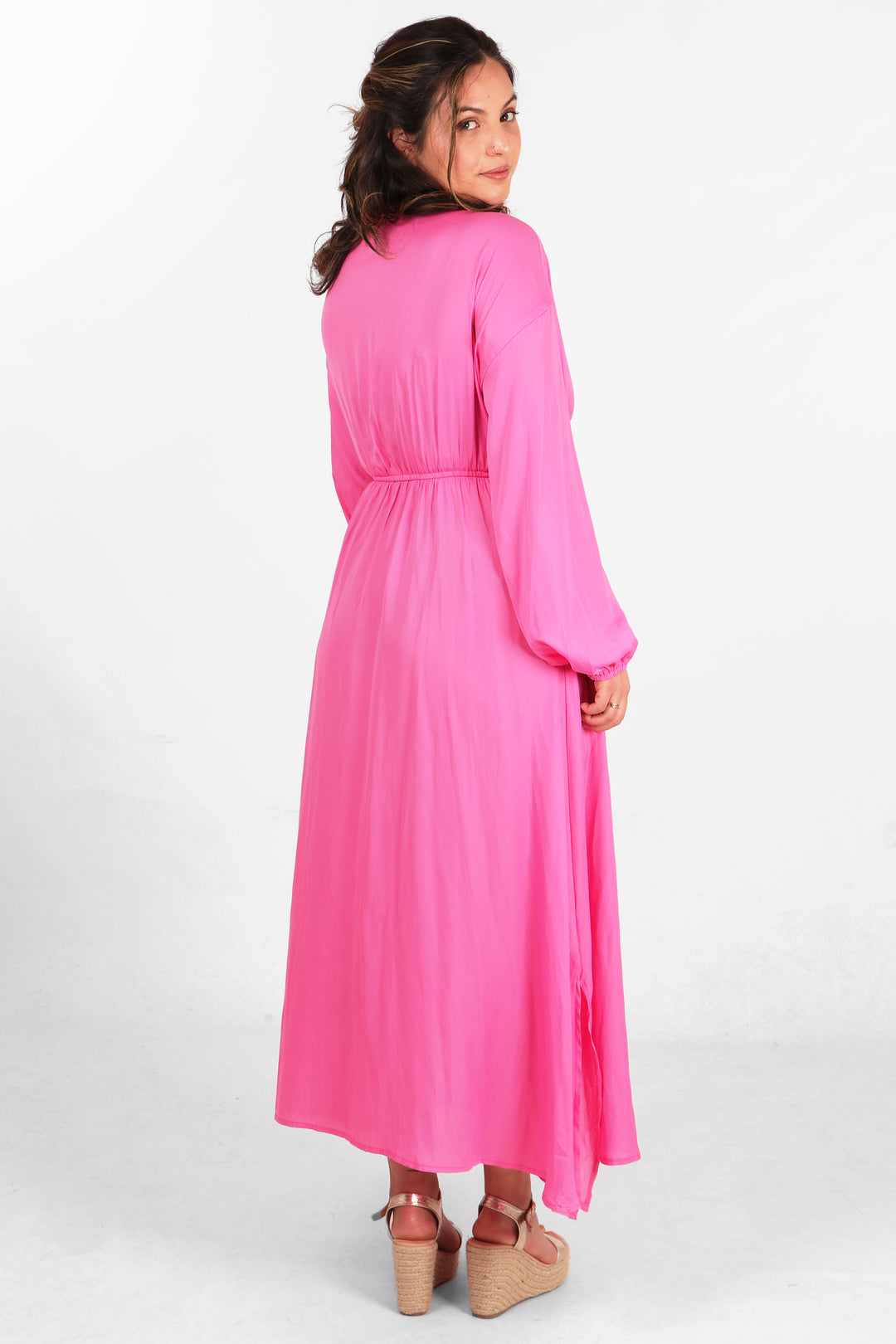 model showing the back of the dress, showing an all over solid pink colour